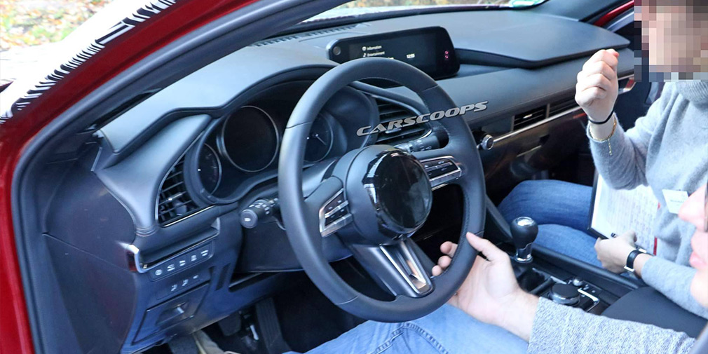 Опубликована первая фотография салона новой Mazda3 1